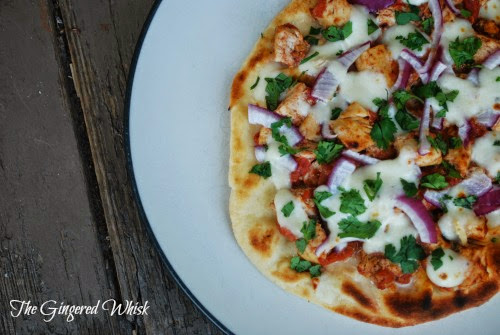 naan pizza with chicken tikka masala and cheese