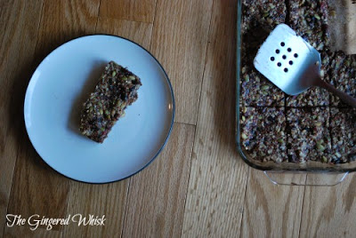 glass baking dish with homemade granola beside plate with granola bar