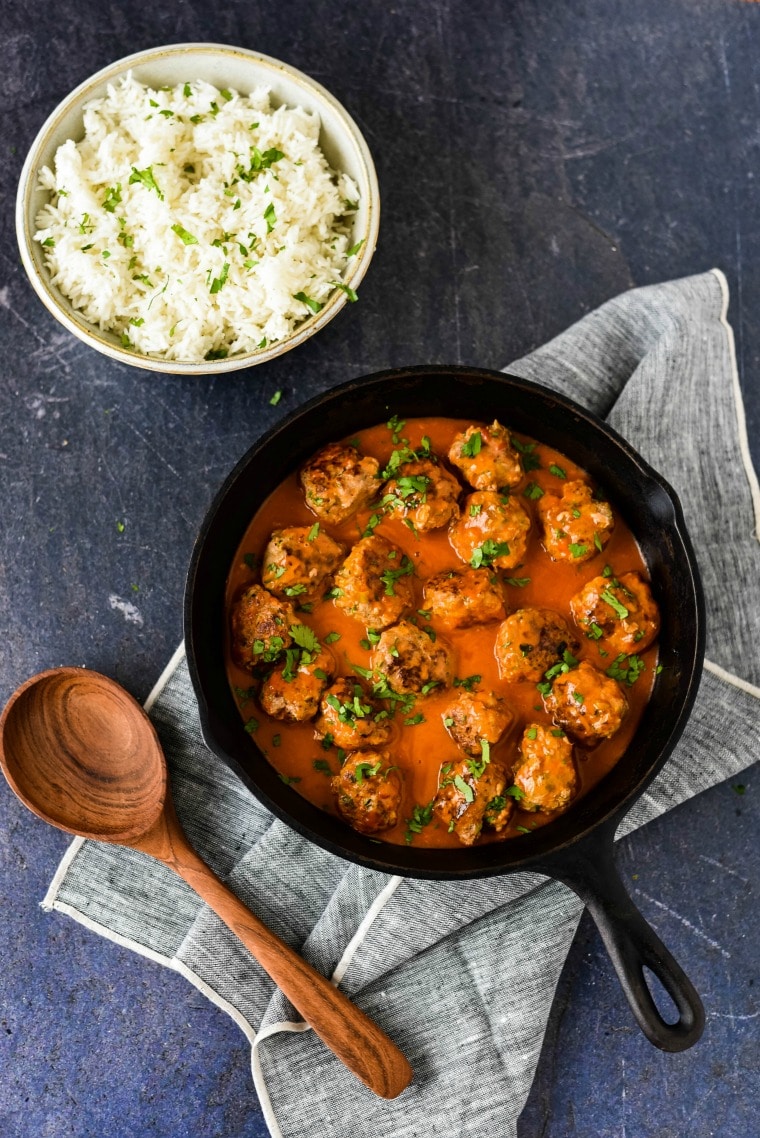 turkey meatballs with thai sauce in cast iron skillet 