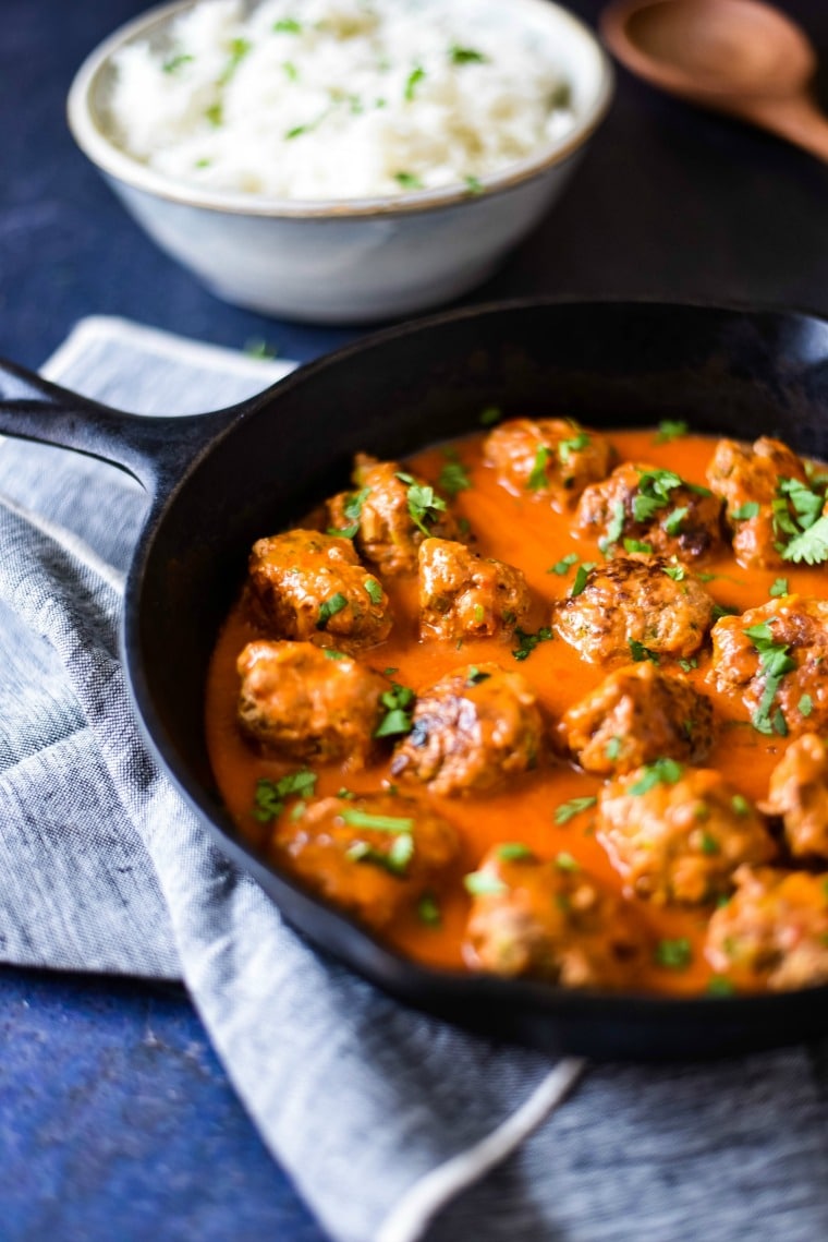 Turkey Zucchini Meatballs with Thai sauce in cast iron skillet