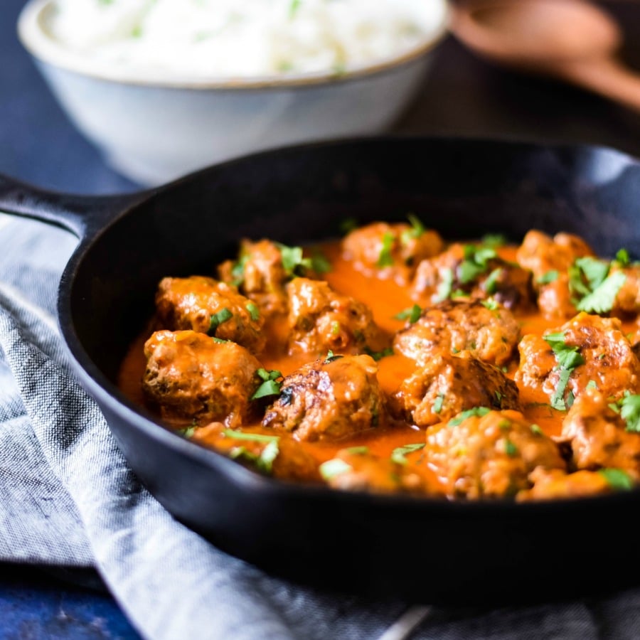 turkey meatballs with thai sauce in cast iron skillet