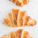 three croissants in a vertical row