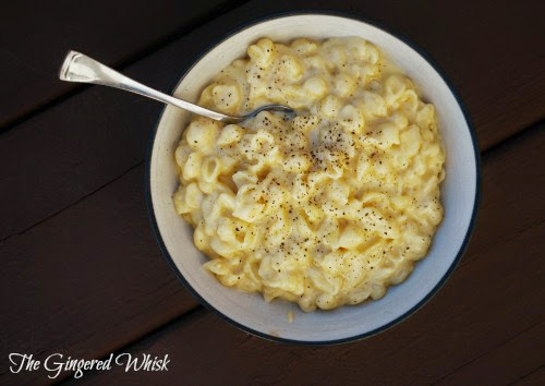 overhead view of bowl of mac and cheese with spoon 