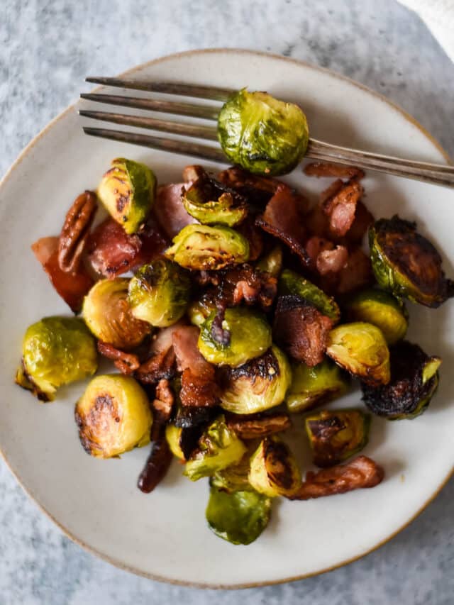 plate with bacon brussels sprouts and fork