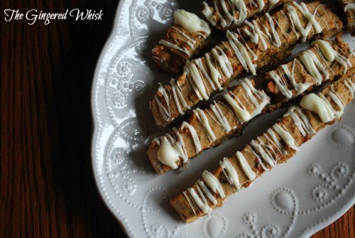 sourdough cinnamon spice biscotti with white chocolate drizzle on top