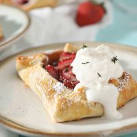 strawberry galette with whipped cream on top