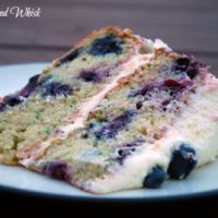slice of cake with blueberries and lemon buttercream