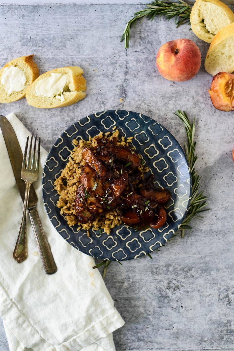 peach balsamic chicken on plate with brown rice