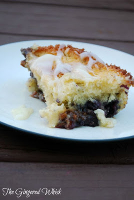 piece of coffee cake with blueberry sauce