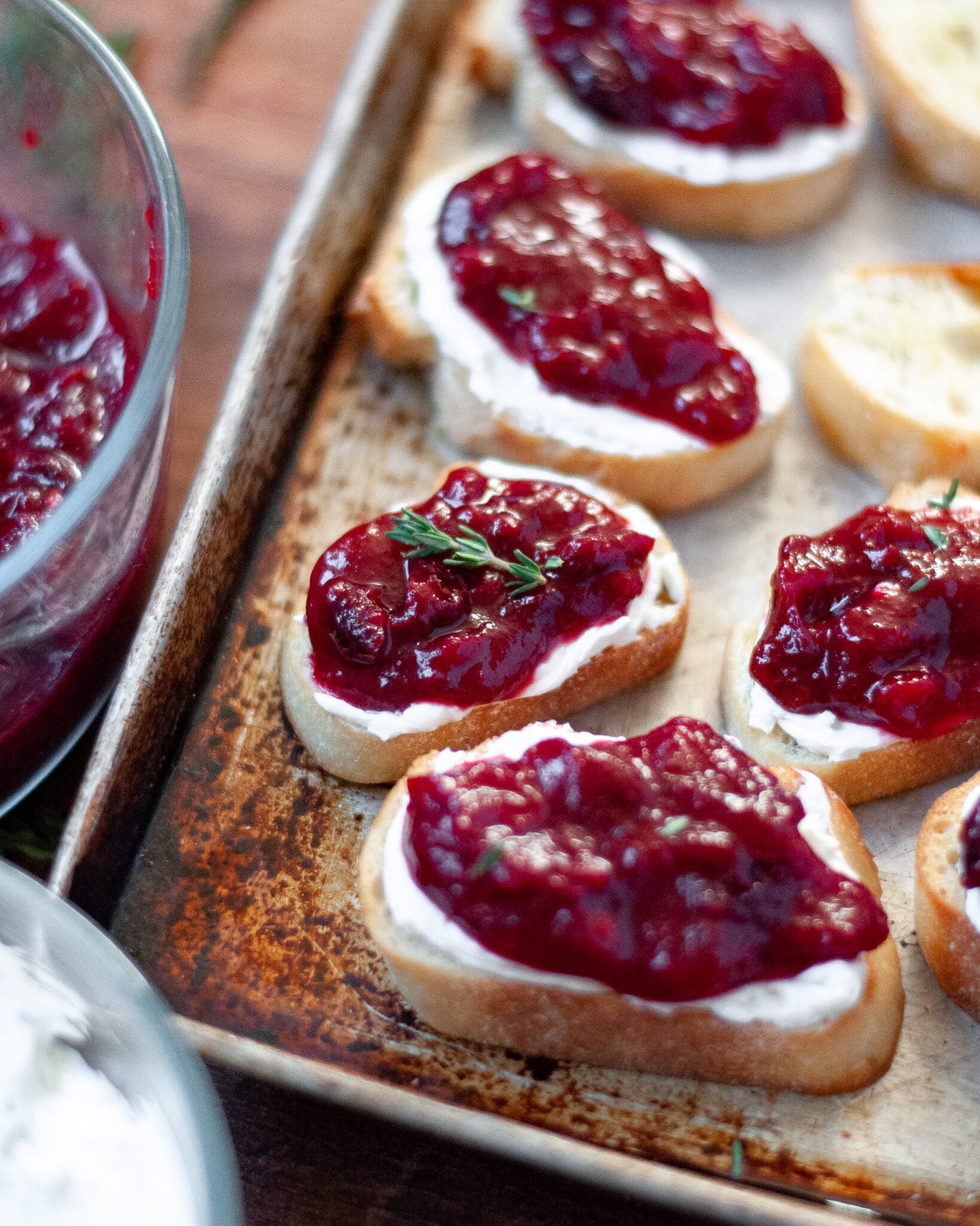 slices of bread with whipped goat cheese and cranberry topping