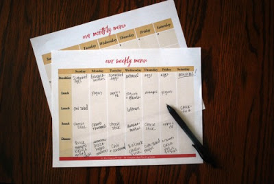 meal planning pages on table with pen