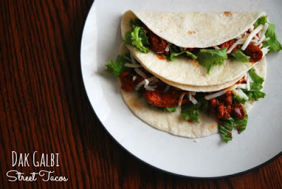two korean chicken tacos with pepper paste