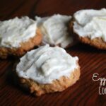 cookies with egg nog frosting on wooden table