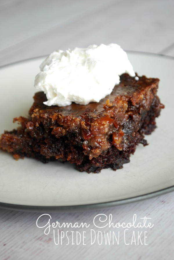 slice of german chocolate cake with whipped cream on plate