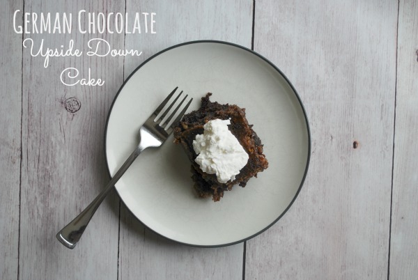 slice of german chocolate cake and whipped cream on plate