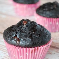 double chocolate zucchini muffins in pink paper wrappers