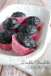 Six chocolate zucchini muffins with pink muffin liners