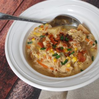 bowl of chicken corn chowder with spoon 