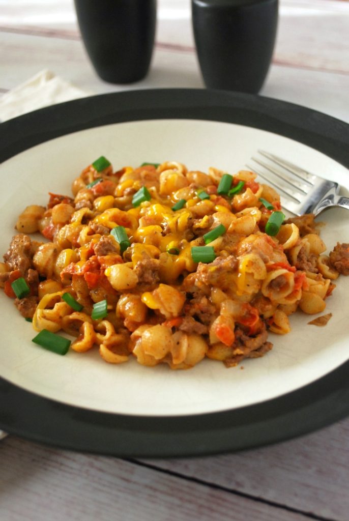 A plate of cheeseburger mac & cheese with a fork