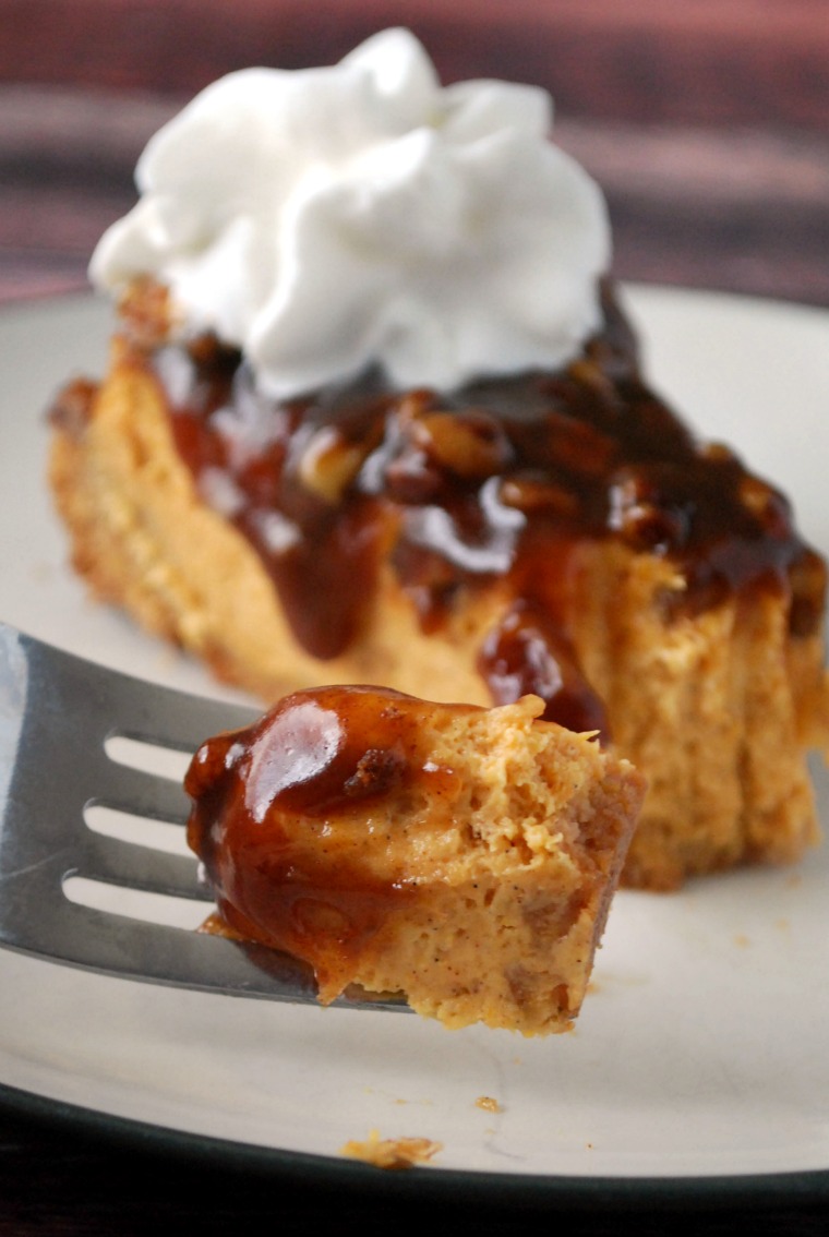 Hey silver fork taking a bite out of a slice of pumpkin praline cheesecake