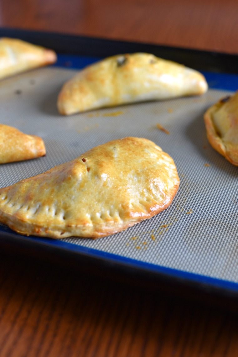 Beef empanadas on a cooking sheet 