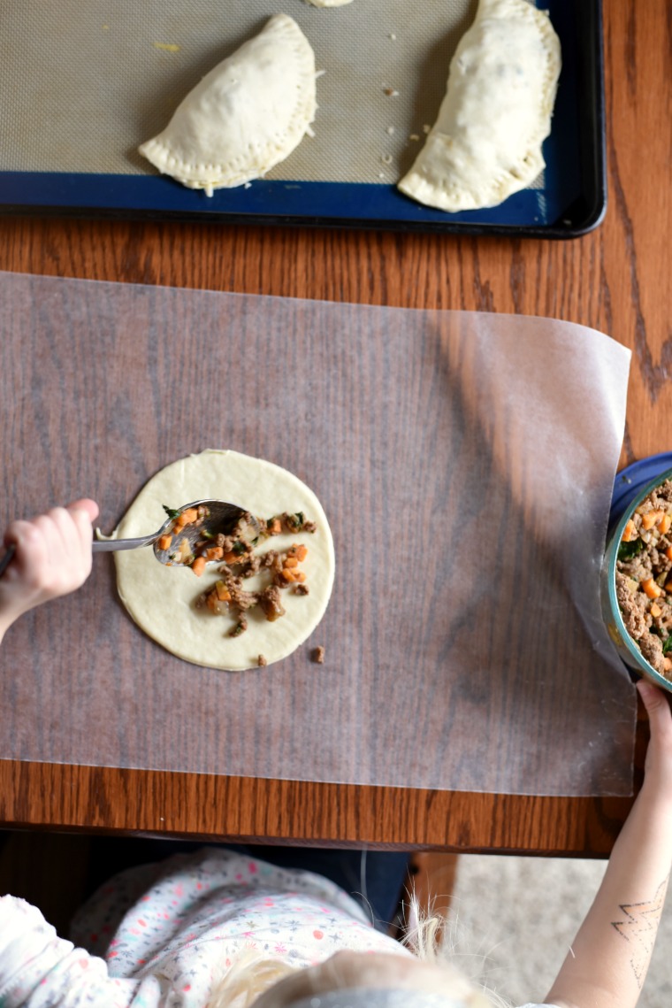 A child making beef empanadas 