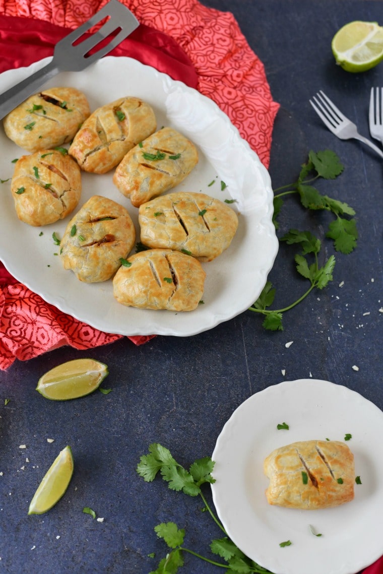 A platter and a plate of beef empanadas 