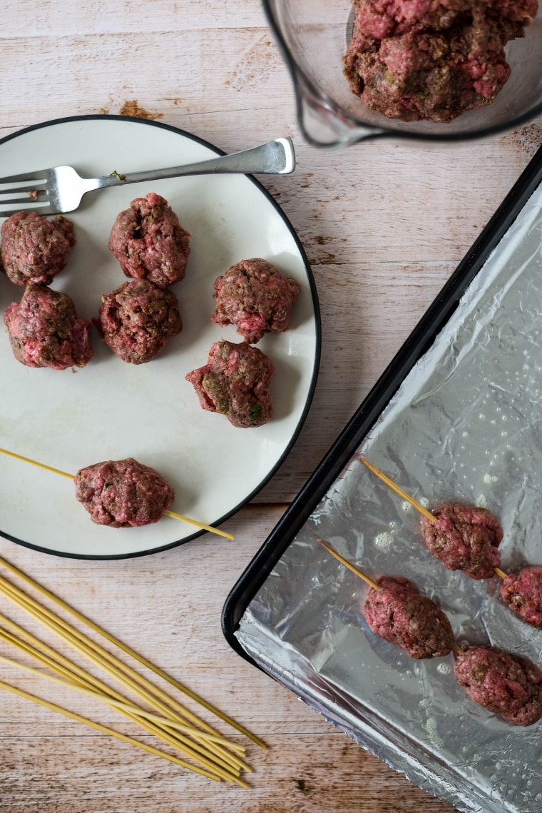 forming beef kofta onto skewers