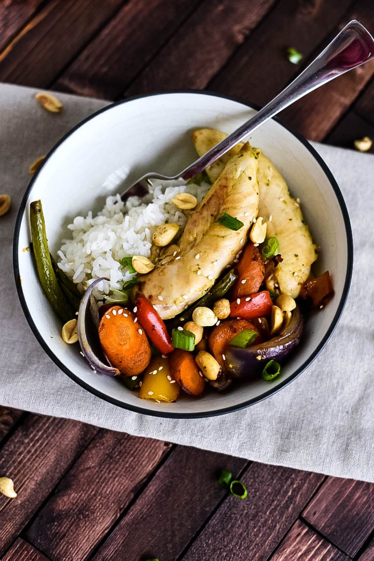 Bowl with sheet pan chicken and vegetables with kung pao sauce