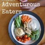 child next to plate of vegetables with text overlay that reads "how to raise adventurous eaters"