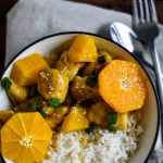 bowl of orange chicken with text overlay of recipe name