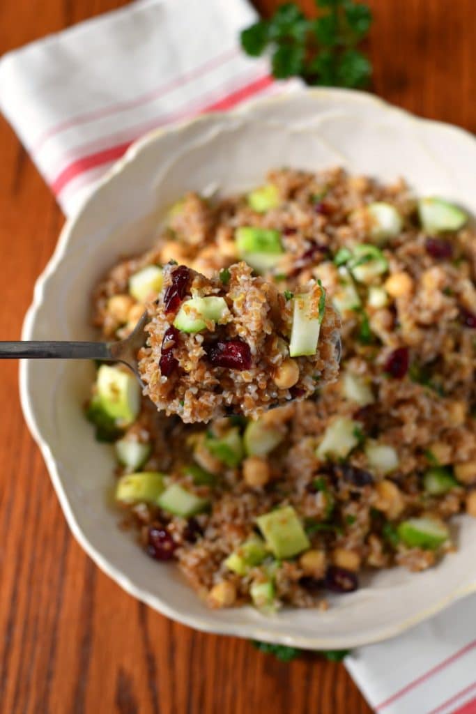 A silver spoon serving bulgur salad