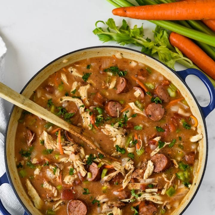 blue cooking pot with chicken sausage gumbo