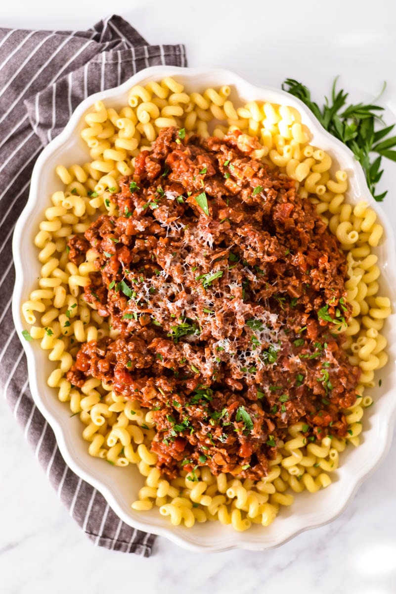 over head view of white platter with beef ragu