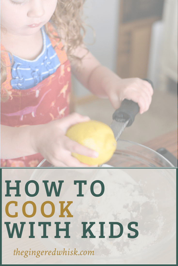A toddler in a red dinosaur apron zesting a lemon over a bowl with a text overlay that reads \"How to cook with kids\"