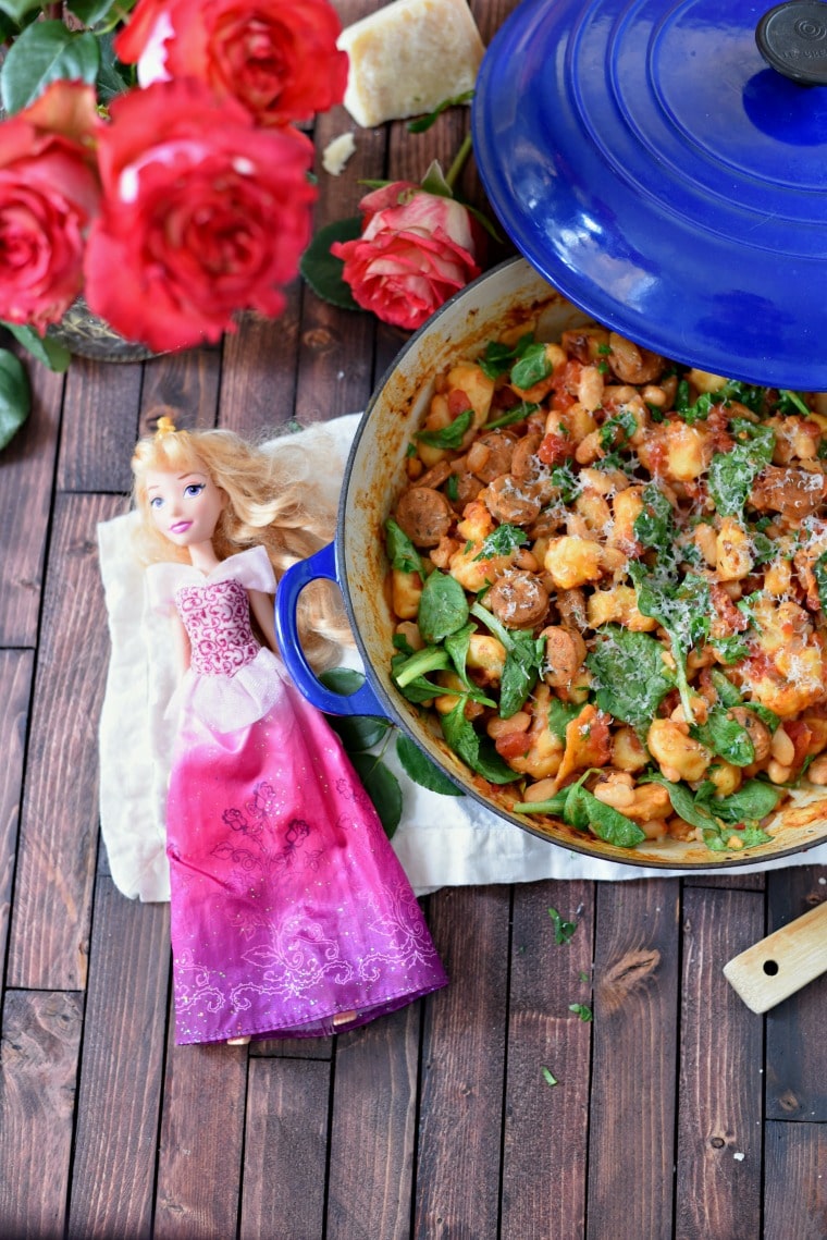 pot with gnocchi and sausage with roses and princess doll