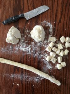 gnocchi dough being rolled and cut