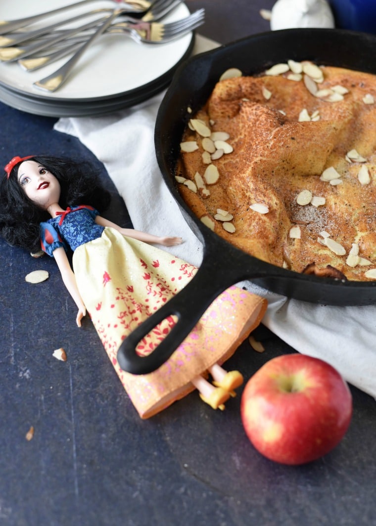 Snow White Doll next to skillet of dutch baby pancake 