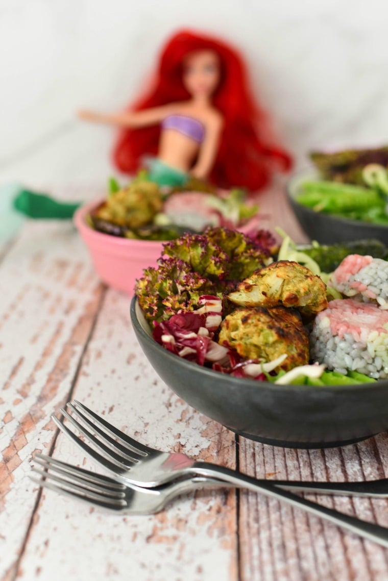 bowl with salad, rainbow rice, and crab cakes