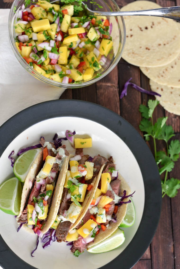 Flank Steak Tacos beside bowl of Pineapple Salsa