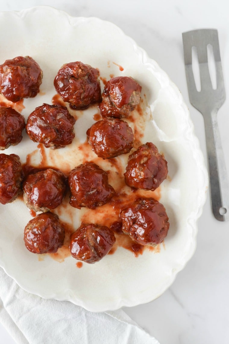 overhead image of white platter with meatballs and glaze 