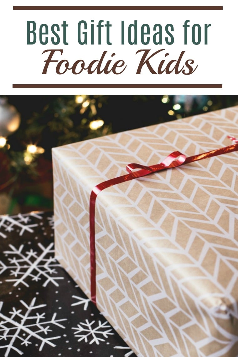 image of present beside christmas tree with text \"gifts for foodie kids\" on top