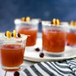 Cranberry Orange Cocktail in four cups on a plate
