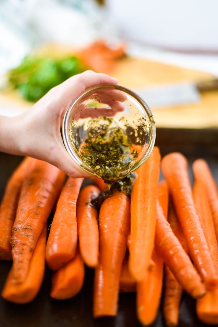 pouring marinade on easy carrots
