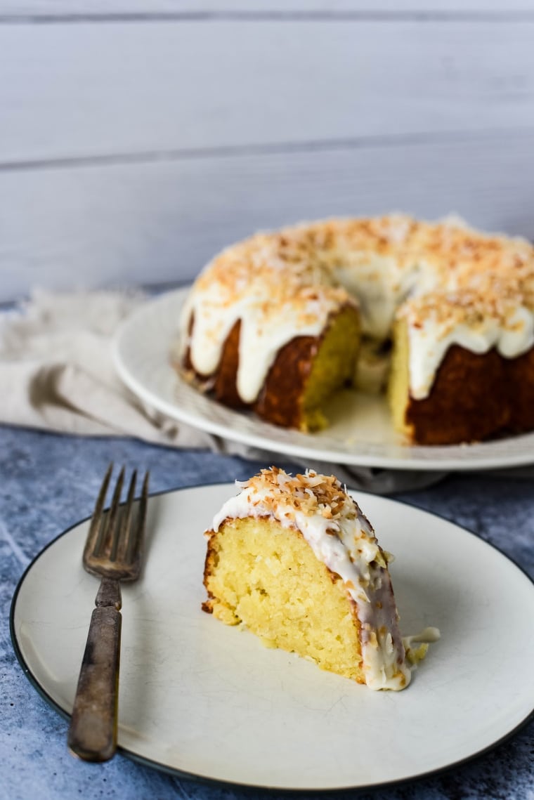 coconut bundt cake with slice on plate