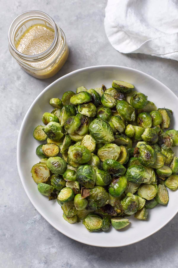 brussels sprouts with dressing on plate