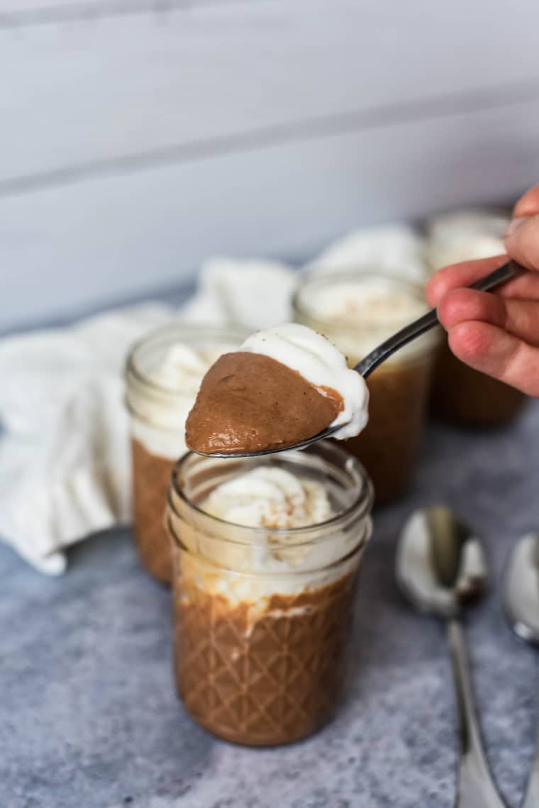 spoon with chocolate panna cotta on it