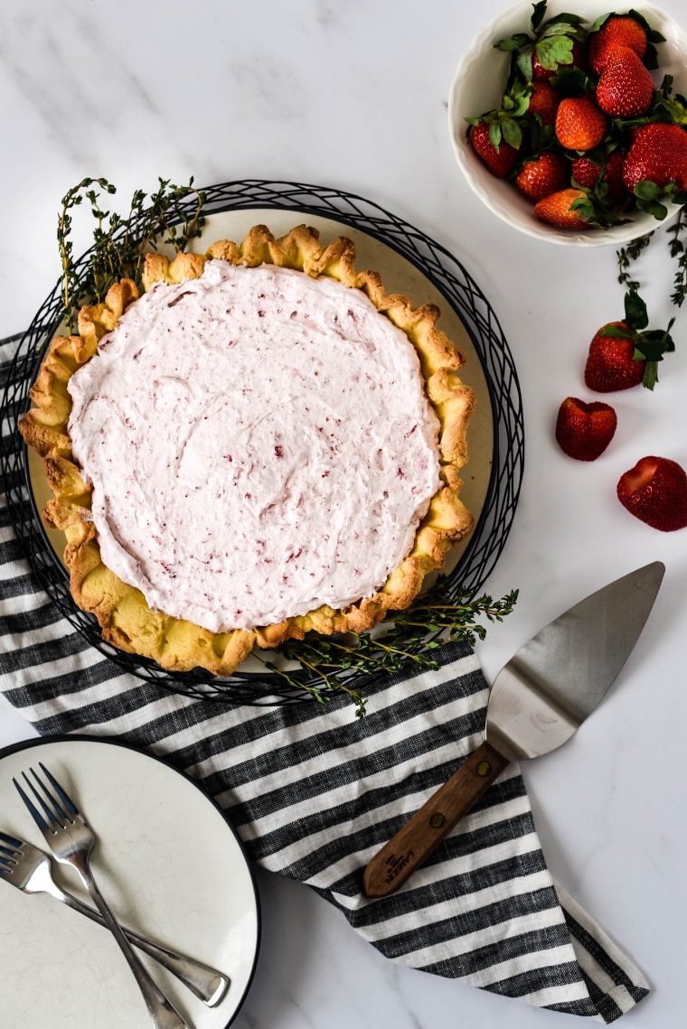 Roasted Strawberry Mousse Tart with plate and serving spatula