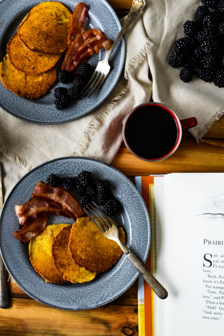 corn cakes on plate with little house on the prairie book