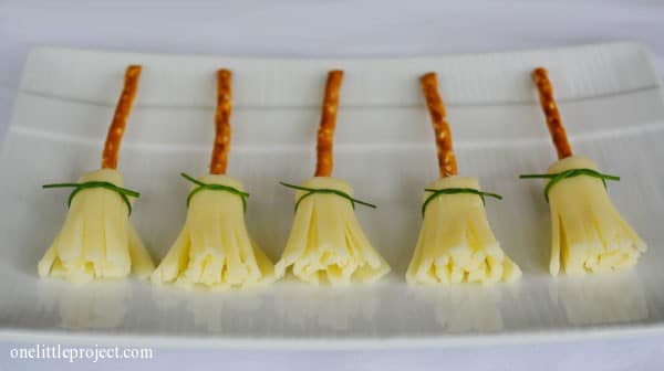 broomsticks made of cheese sticks that have been cut into strips and pretzel sticks